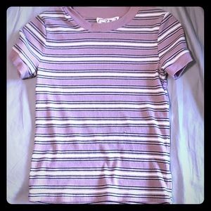 purple t-shirt with white and black stripes